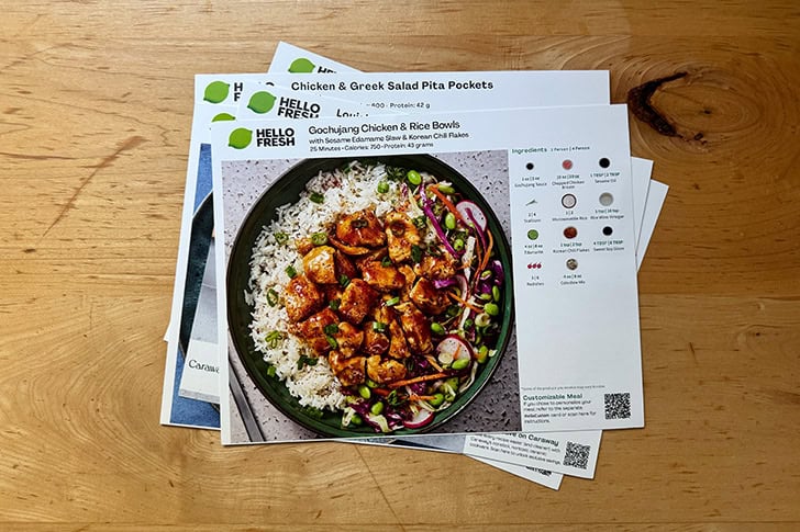 A stack of Hello Fresh recipe cards.