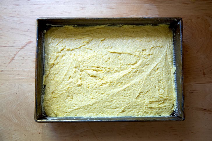 Cornbread batter spread into a 9x13-inch pan.