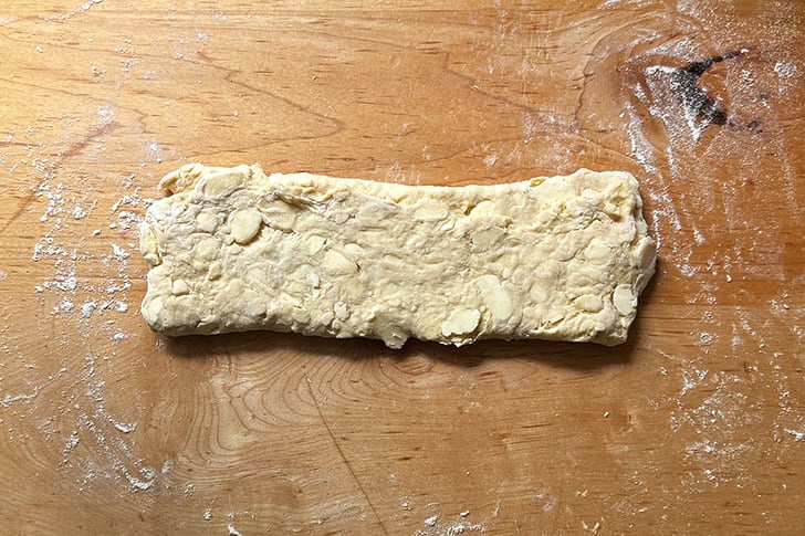 Croissant dough folded from bottom to top.
