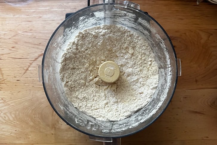 The butter to make cheater's croissant dough cut into the dry ingredients in a food processor