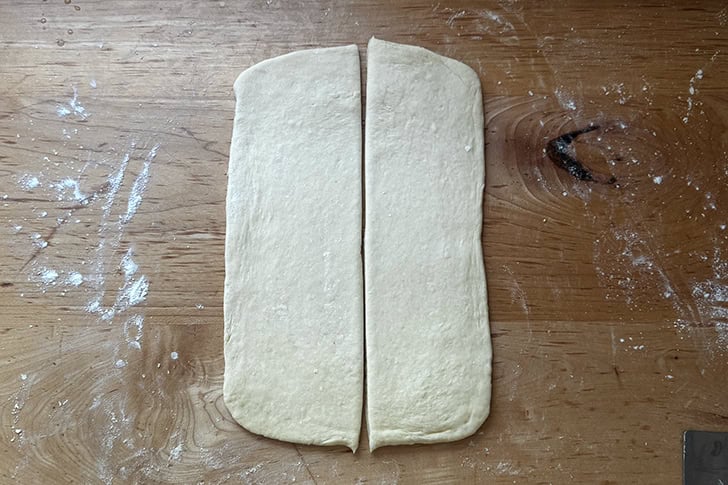 Croissant dough, halved vertically.