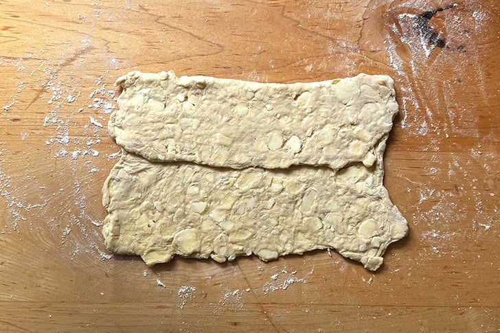 Croissant dough folded from top to bottom.