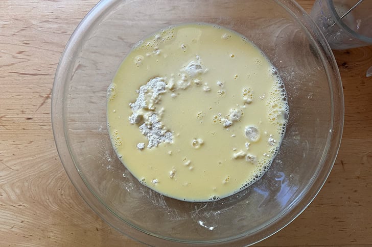 The wet ingredients added to the dry ingredients of cheater's croissant dough.