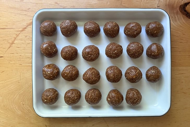 A tray filled with balled up energy bites.