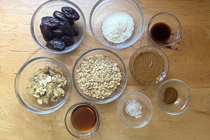 The ingredients to make homemade energy bites on a countertop.