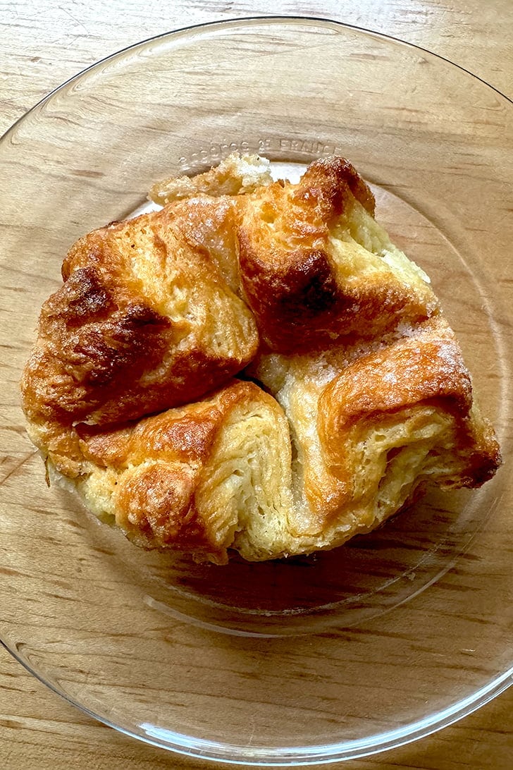A single Kouign-Amann on a plate.