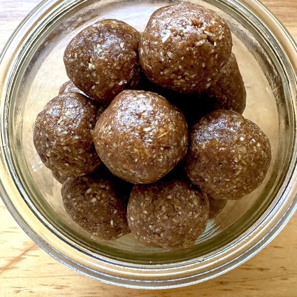 A jar filled with no-bake energy bites.